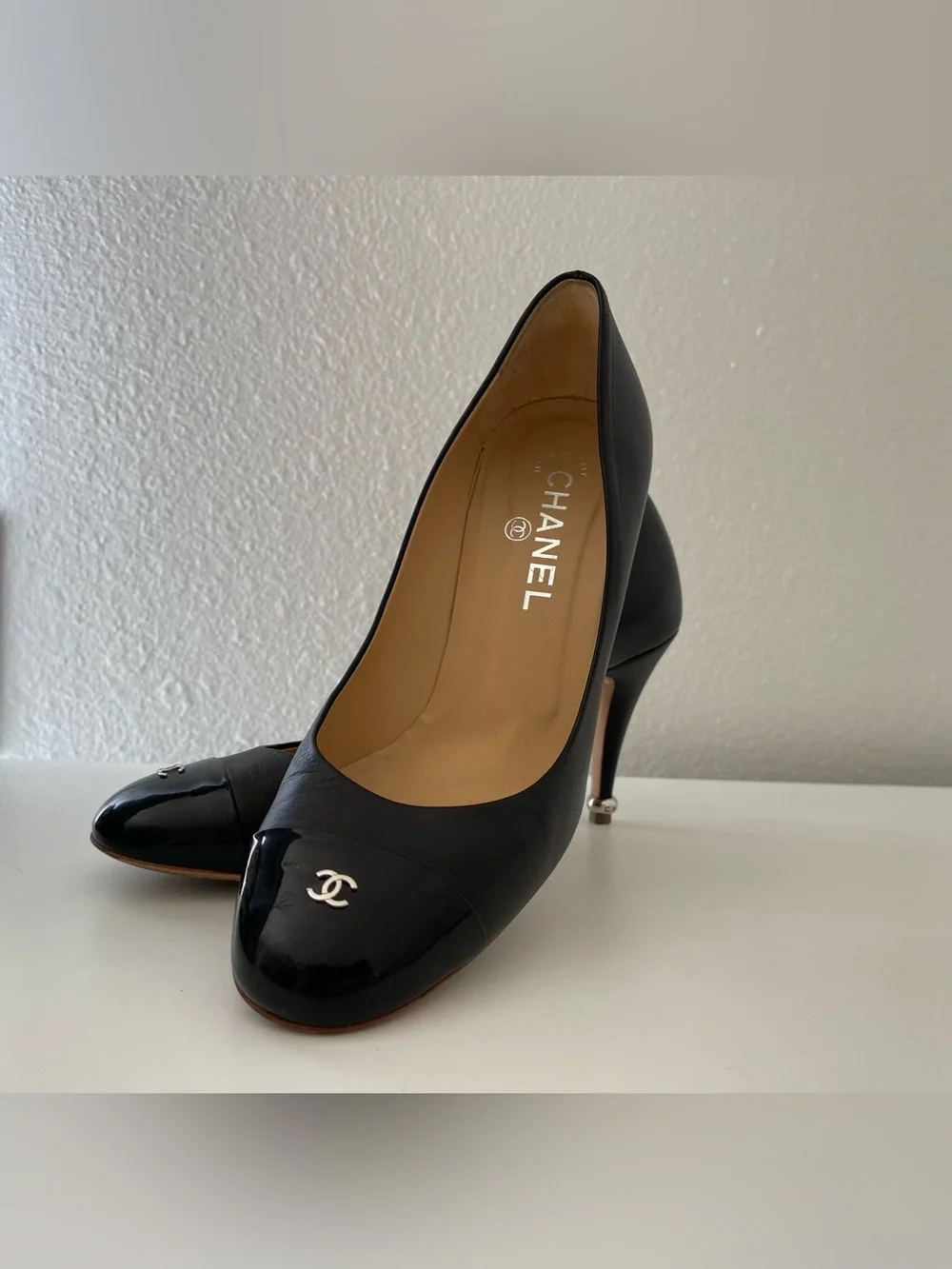 CHANEL Black Leather and Patent Cap-Toe Pump with CC Emblem